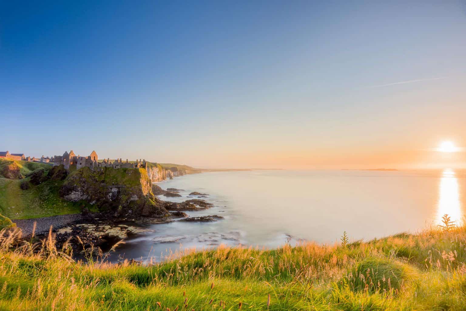 Sunset at Dunluce Castle in Co Antrim photograph taken by Kieran Hayes of Landscape Photography Ireland.